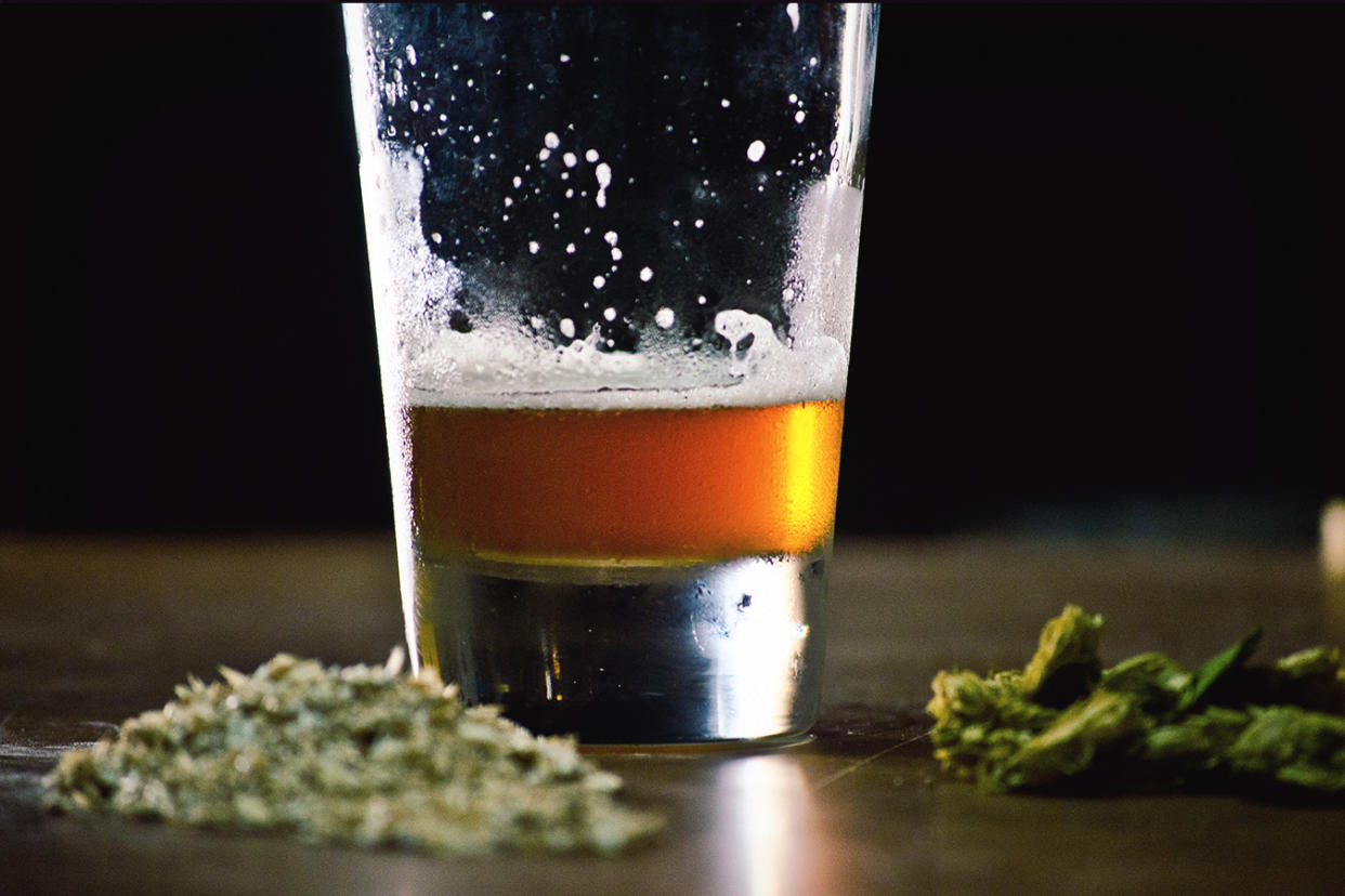 Close-Up Of Beer And Cannabis On Table