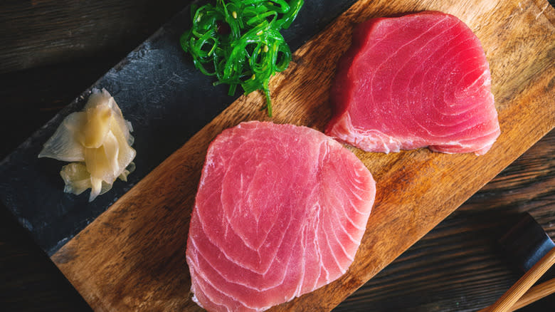 raw tuna steaks on board