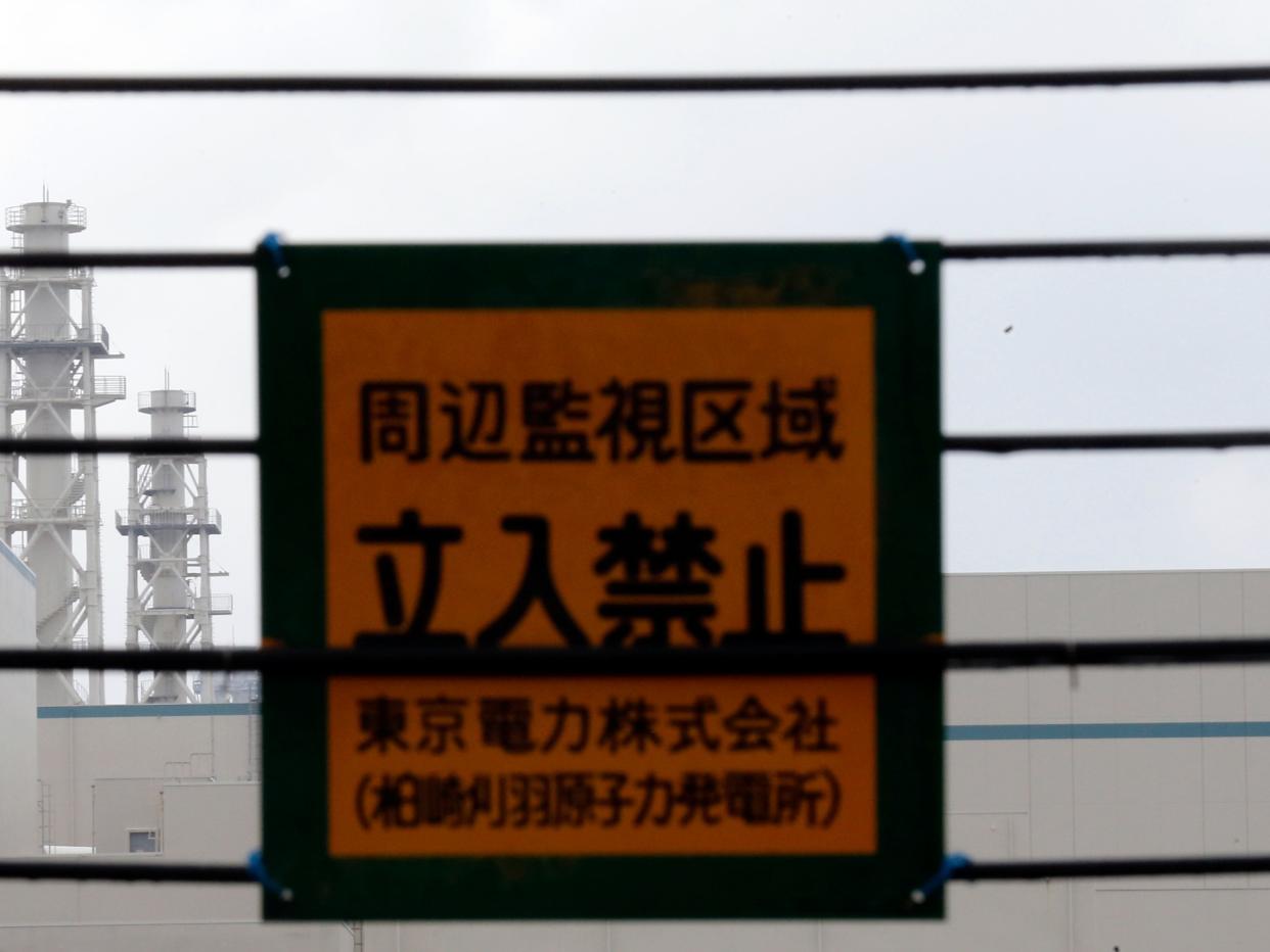 Tokyo Electric Power Co.'s Kashiwazaki Kariwa nuclear power plant, which is the world's biggest, is seen behind a wire fence bearing a notice saying 'No Entry' from a sea shore in Kashiwazaki