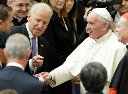 U.S. Vice President Joe Biden (L) talks with Pope Francis in Paul VI hall at the Vatican April 29, 2016. REUTERS/Max Rossi