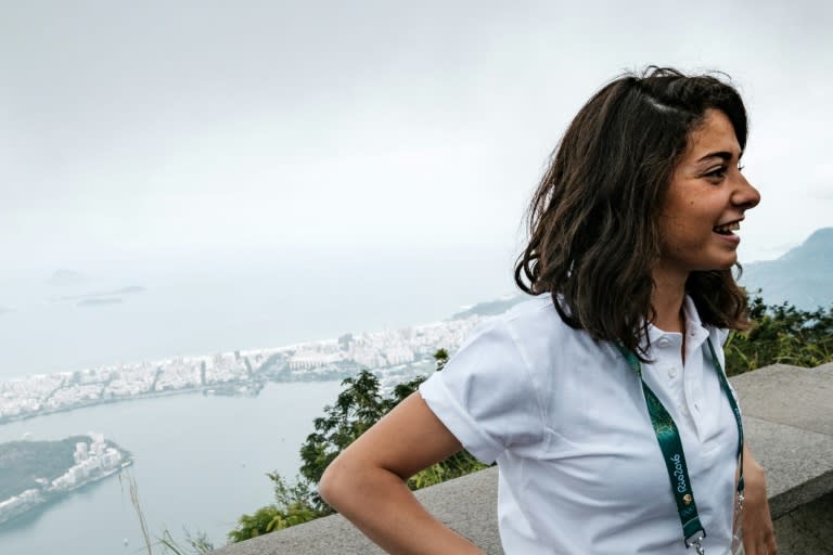 Syria's swimmer Yusra Mardini based in Germany for the Refugee Olympic Team (ROT) visits the statue of Christ the Redeemer, ahead of Rio 2016 Olympic games