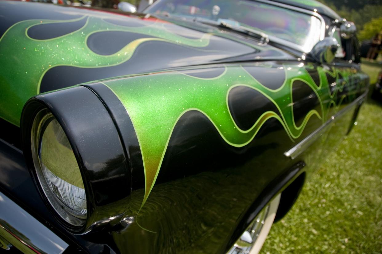 Deep metallic green paint on a classic American car from the early 1950's.