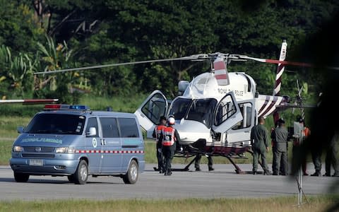 An ambulance carrying rescued schoolboys travels to a hospital from a military airport  - Credit: ATHIT PERAWONGMETHA /Reuters