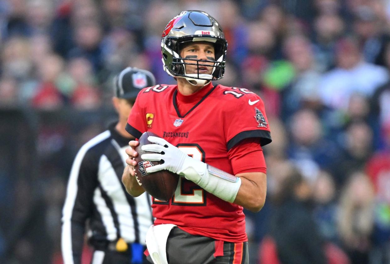 MUNICH, GERMANY - NOVEMBER 13: Tom Brady #12 of the Tampa Bay Buccaneers prepares to throw a pass during the NFL match between Seattle Seahawks and Tampa Bay Buccaneers at Allianz Arena on November 13, 2022 in Munich, Germany. (Photo by Sebastian Widmann/Getty Images)