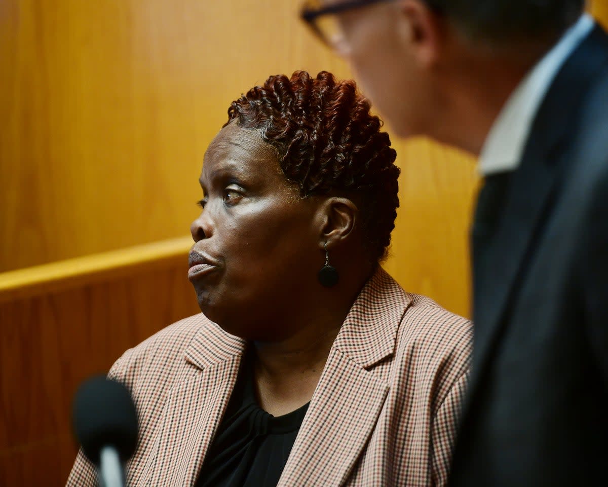 Wanda Geter-Pataky watches video of herself in court placing absentee ballots into election drop boxes. She is now one of four people criminally charged in connection to the case.   (Connecticut Post)