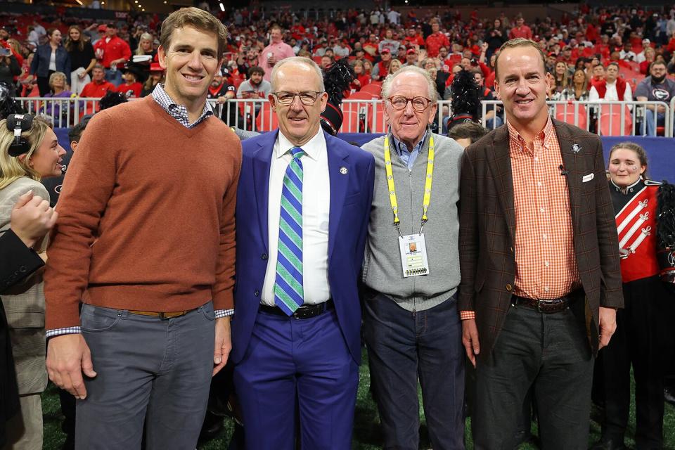 Former Football Quarterbacks Eli Manning (L), Archie Manning (2R) and Peyton Manning (R)pose with SEC Commissioner Greg Sankey (2L) prior to the SEC Championship game between the LSU Tigers and the Georgia Bulldogs at Mercedes-Benz Stadium on December 03, 2022 in Atlanta, Georgia.