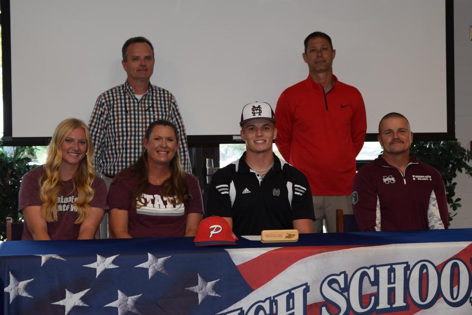 (Bottom row L-R: Shelby McKenzie, Amy McKenzie, Jackson McKenzie, Brooks McKenzie. Back Row: Pace principal Stephen Shell, Pace head coach Jason McBride)
Pace pitcher/first baseman Jackson McKenzie signs his letter of intent to play baseball for Mississippi State University on Wednesday, Nov. 9, 2022 from Pace High School.