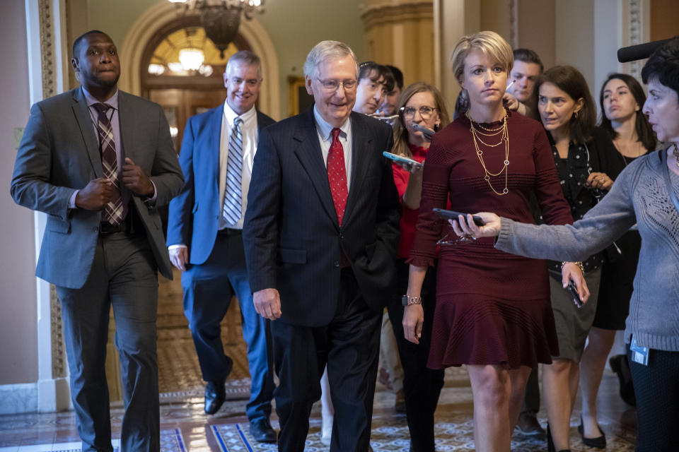With reporters following, Senate Majority Leader Mitch McConnell, R-Ky., returns to his office after speaking on the Senate floor about Supreme Court nominee Brett Kavanaugh, on Capitol Hill in Washington, Monday, Sept. 24, 2018. (AP Photo/J. Scott Applewhite)