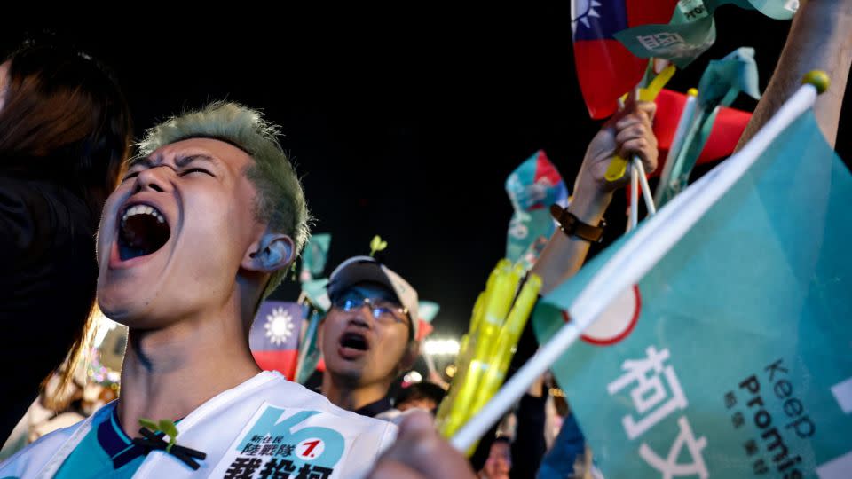 Supporters cheer at a campaign rally for Taiwan People's Party (TPP) presidential candidate Ko Wen-je in Taichung on January 6, 2024. - I-Hwa Cheng/AFP/Getty Images