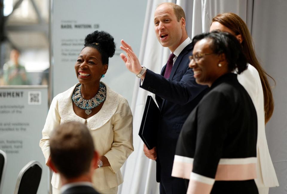 William, Duke of Cambridge and Catherine, Duchess of Cambridge accompanied by Baroness Floella Benjamin (L) attend the unveiling of the National Windrush Monument at Waterloo Station