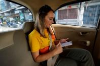 Lillian Smith, from Mississippi, rides in a taxi as she goes on a tour in Bangkok