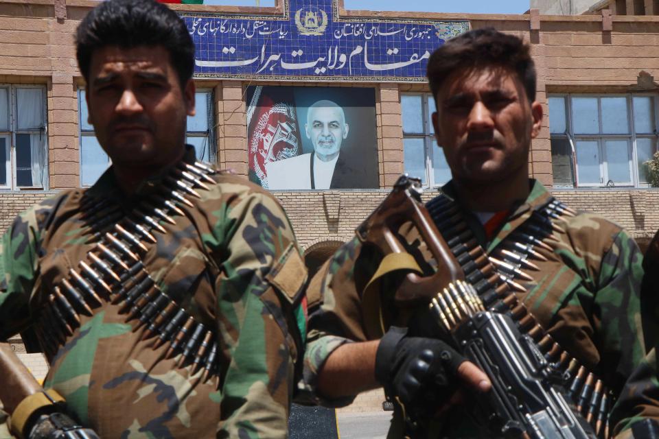 Afghan security officials arrive as part of a reinforcement to fight against Taliban militants as they push to gain access to the city in Herat (EPA)