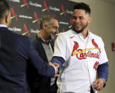 New starting catcher for the St. Louis Cardinals Willson Contreras, right, shakes hands with Cardinals manager Oliver Marmol after a news conference at Busch Stadium in St. Louis, Friday, Dec. 9, 2022. The team officially signed Contreras to a five-year contract with a club option for 2028. (David Carson/St. Louis Post-Dispatch via AP)