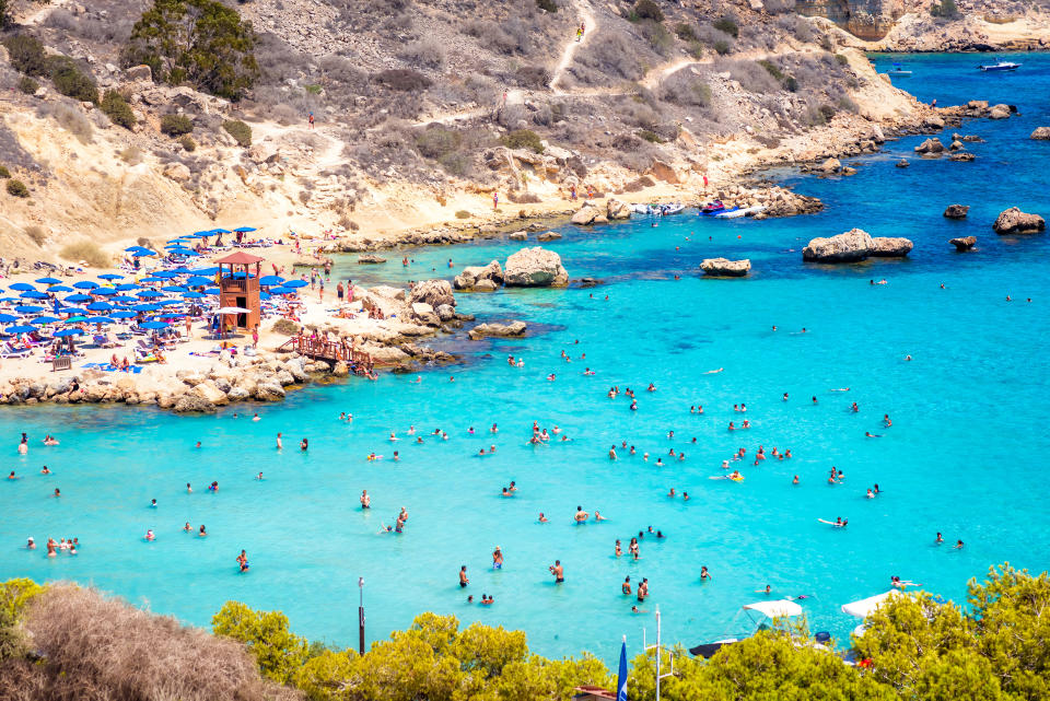 People at the famous beach of Konnos Bay beach near Protaras in Cyprus. (Getty Images)