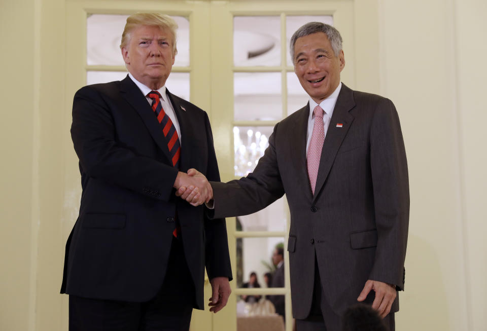 <p>President Donald Trump shakes hands as he meets with Singapore Prime Minister Lee Hsien Loong ahead of a summit with North Korean leader Kim Jong Un, June 11, 2018, in Singapore. (Photo: Evan Vucci/AP) </p>