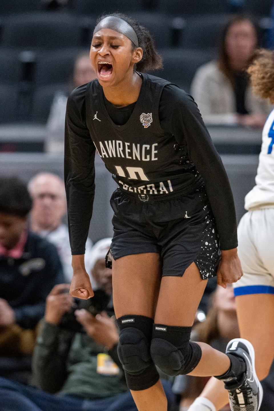 Lawrence Central High School junior Jaylah Lampley (10) reacts to scoring during the first half of an IHSAA class 4A girls’ basketball state finals game against Lake Central high School, Saturday, Feb. 24, 2024, at Gainbridge Fieldhouse, in Indianapolis.