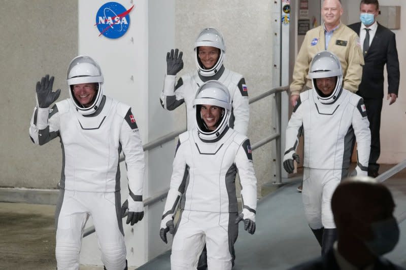 Astronauts walk out to board a Crew Dragon spacecraft to be launched by a SpaceX Falcon 9 from NASA's Kennedy Space Center in Florida early Saturday morning, Photo by Pat Benic/UPI