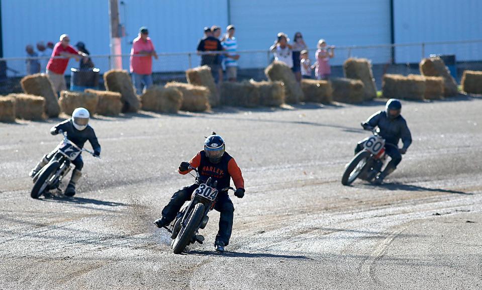 Motorcycles race on the Ashland County Fairgrounds race track during the AMA Vintage Motorcyle races Saturday, July 23, 2022. TOM E. PUSKAR/ASHLAND TIMES-GAZETTE