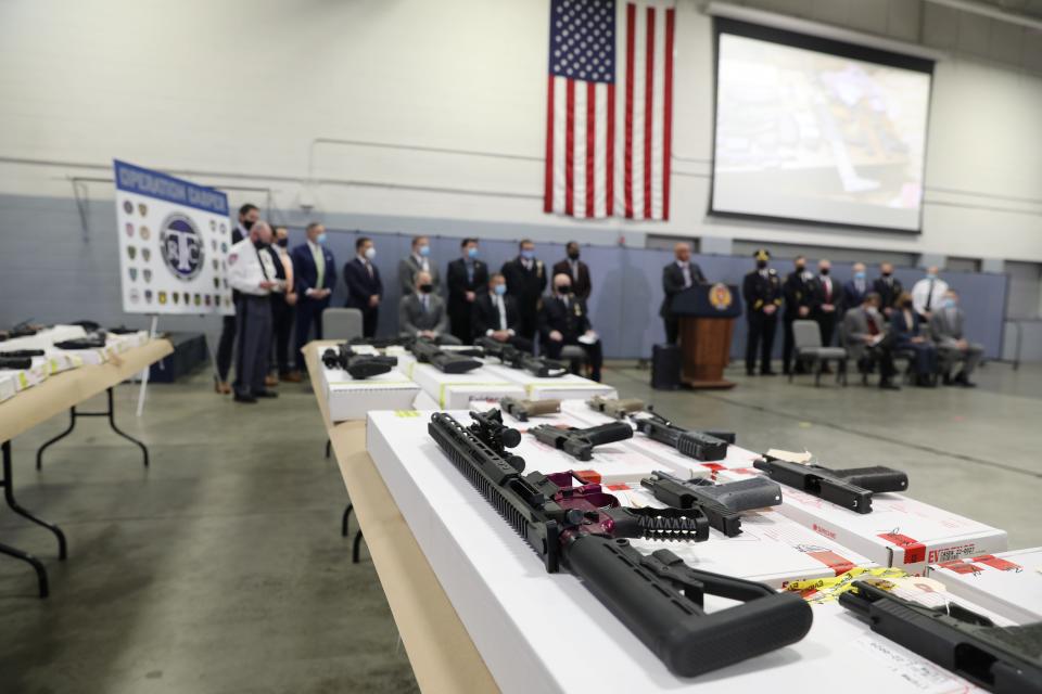 Weapons seized in "Operation Casper," a six-month investigation by county, local and federal law enforcement in Westchester and Putnam counties are on display Jan. 27, 2022 at Westchester Police Academy in Valhalla. More than 100 weapons, including rifles, handguns, "ghost guns" and high-capacity drum magazines were seized and 11 people were arrested facing state and federal charges.
