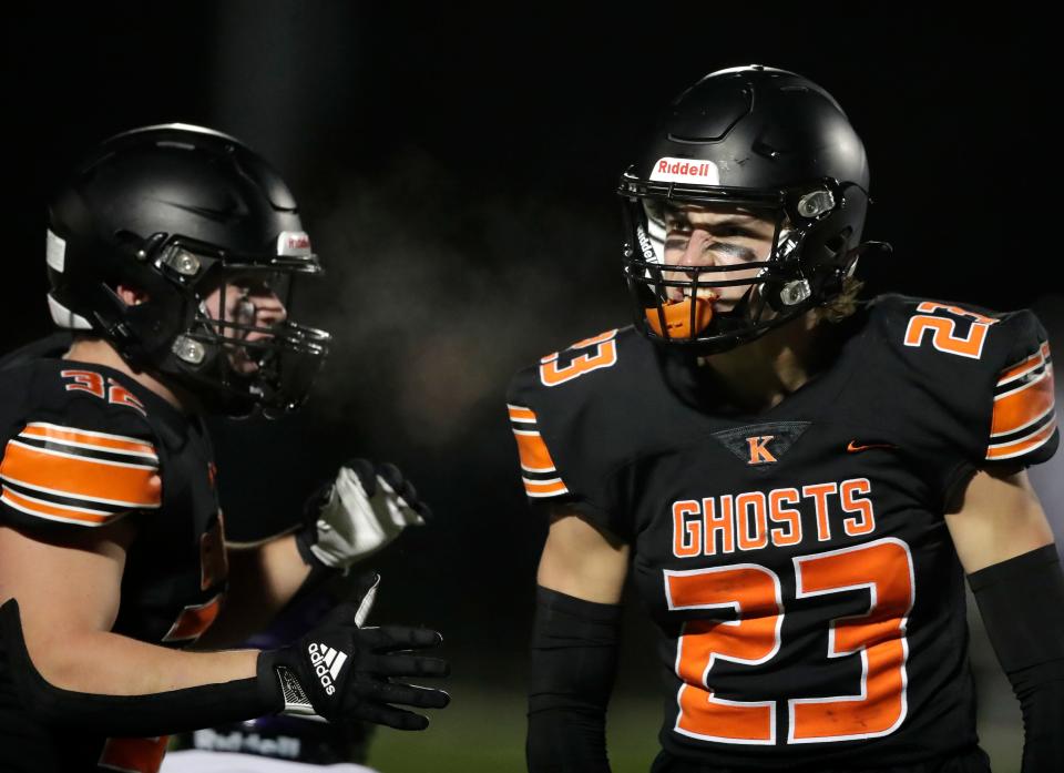 Kaukauna High School's Carson Van Dinter (23) celebrate a stop against Waunakee in a state semifinal game on Nov. 10.