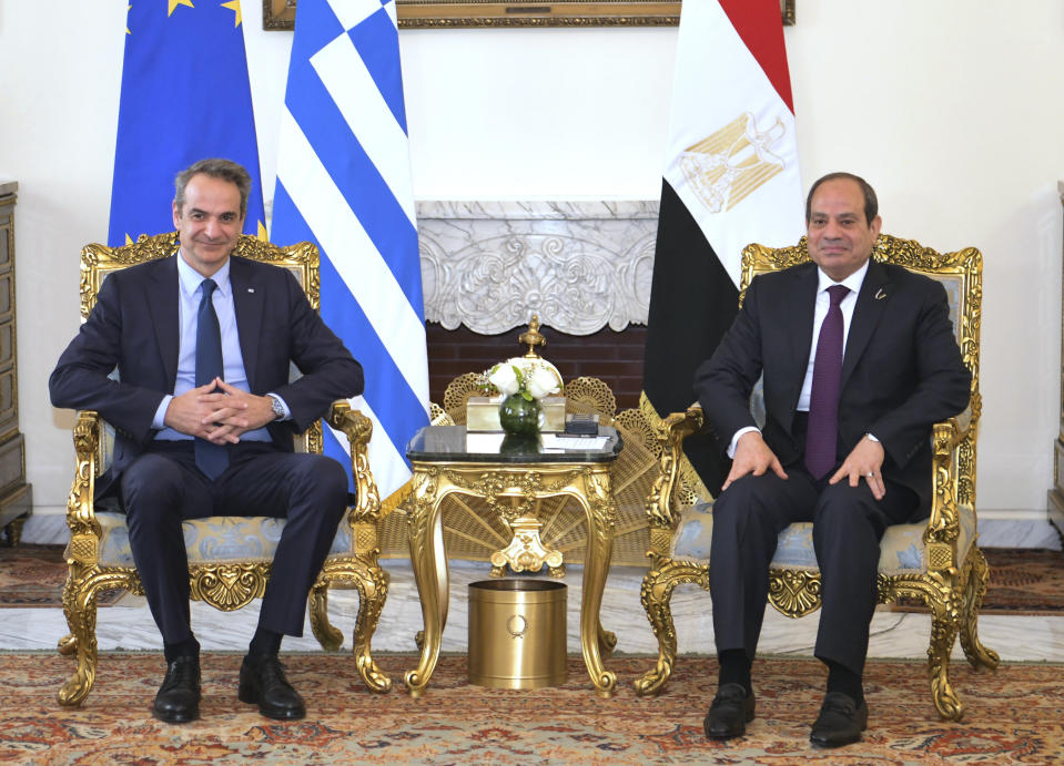 In this photo provided by Egypt's presidency media office, Egyptian President Abdel-Fattah el-Sissi, right, meets Greek Prime Minister Kyriakos Mitsotakis at the Presidential Palace in Cairo, Egypt, Sunday, March 17, 2024. (Egyptian Presidency Media Office via AP)