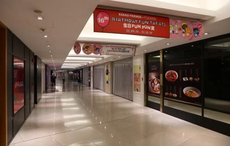 Closed stores are seen inside a shopping mall in Admiralty district, in Hong Kong