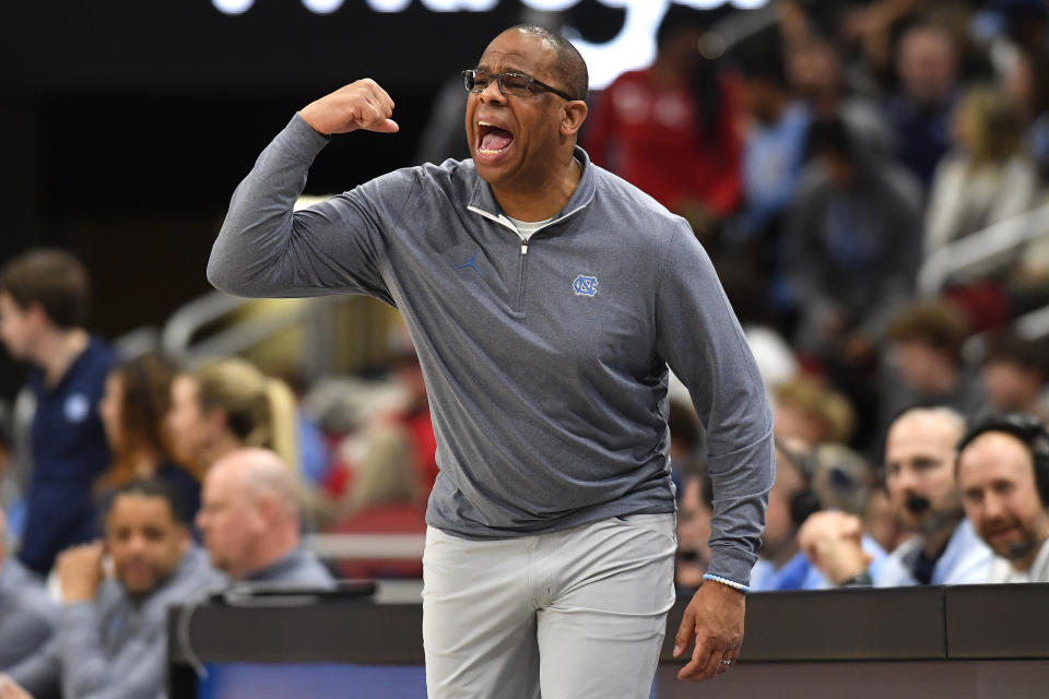 North Carolina head coach Hubert Davis shouts at his team during the second half of an NCAA college basketball game against Louisville in Louisville, Ky., Saturday, Jan. 14, 2023. North Carolina won 80-59. (AP Photo/Timothy D. Easley)