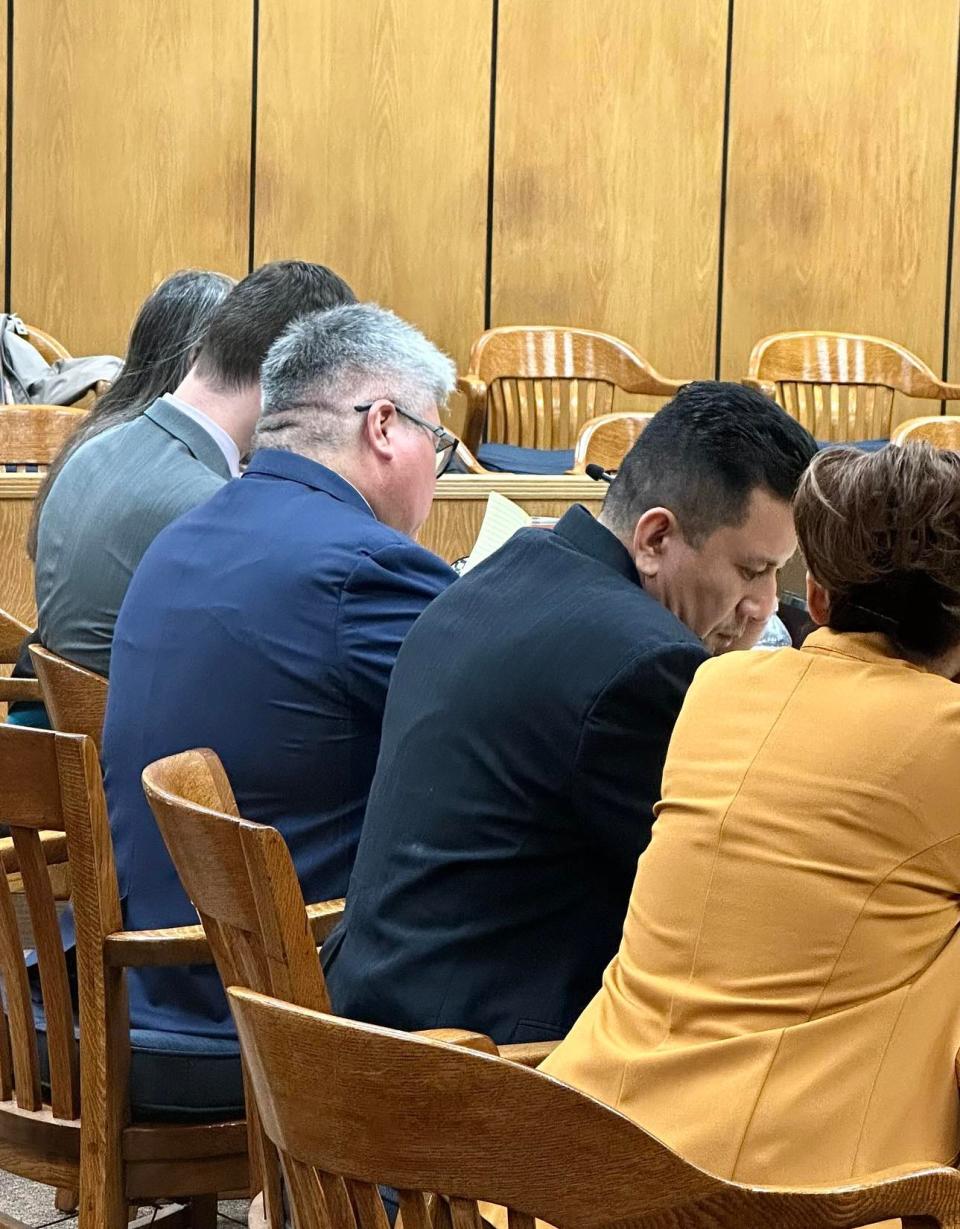 Pedro Rojas-Antonio, second from right, is on trial this week in 89th District Court for charges of child sexual assault and indecency with a child. His defense lawyer is Michael Valverde, third from right. He is conferring with an interpreter, far right.