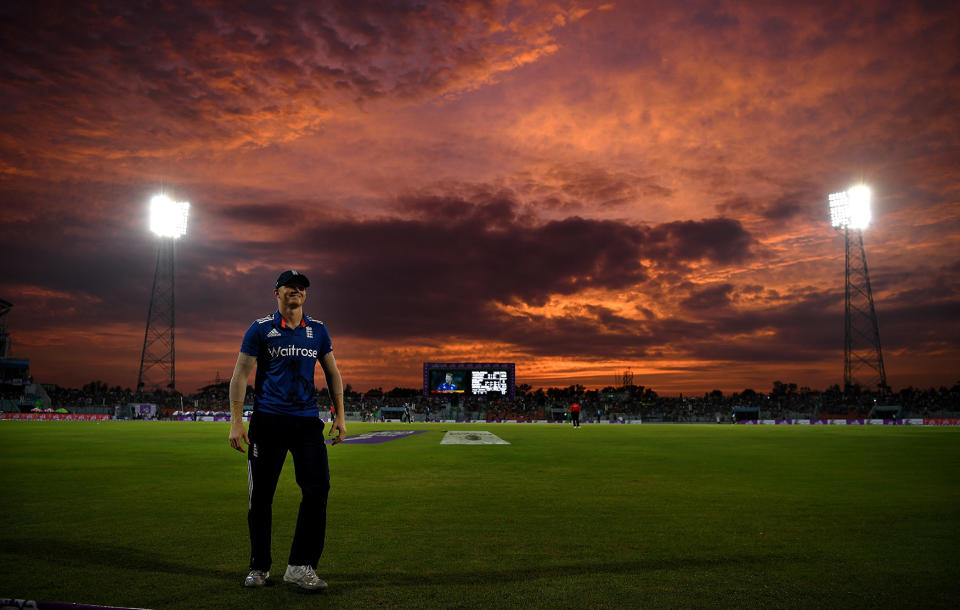 Sam Billings of England fields on the boundary as the sunsets