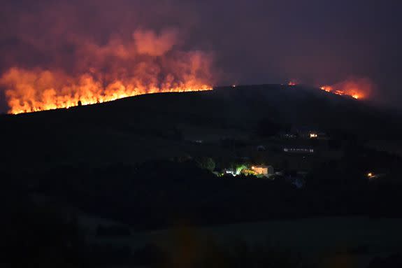 A large wildfire sweeps across the moors between Dovestones and Buckton Vale in Stalybridge, Greater Manchester.