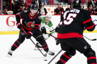 Dallas Stars' Jacob Peterson (40) looks on as Ottawa Senators' Thomas Chabot (72) receives a pass during the first period of an NHL hockey game, Sunday, Oct. 17, 2021, in Ottawa, Ontario. (Sean Kilpatrick/The Canadian Press via AP)