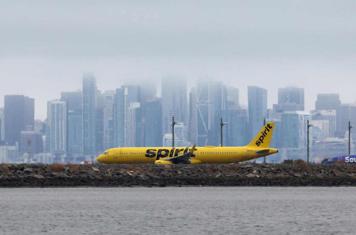 OAKLAND, CALIFORNIA - JULY 28: A Spirit Airlines plane prepares to take off from Oakland International Airport on July 28, 2022 in Oakland, California. JetBlue Airways announced plans to purchase low-cost airline Spirit Airlines, a merger that would create the U.S.'s fifth-largest airline. (Photo by Justin Sullivan/Getty Images)