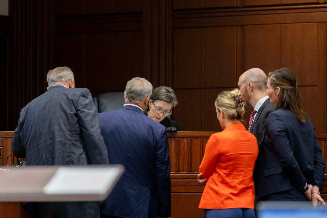 Attorneys and prosecutors stand before Fayette Circuit Judge Lucy VanMeter on Tuesday during the rape trial against John Tilley.