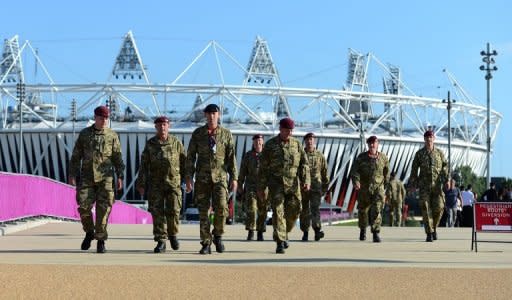 British soldiers walk near the Olympic stadium at the Olympic Park in London on July 22, 2012. The London 2012 Olympic Games begins on July 27, 2012. AFP PHOTO/Carl de Souza