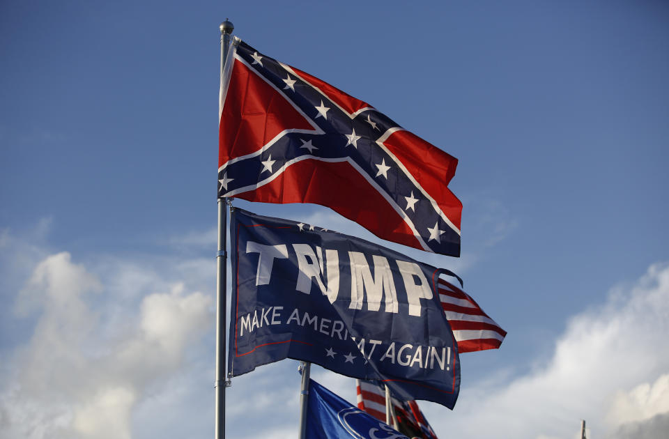 A Trump "Make America Great Again" flag flies below a Confederate flag at a private campground by the Bristol Motor Speedway in Bristol, Tennesee. NASCAR recently banned Confederate flags from its tracks. (Photo: Jessica Rinaldi/The Boston Globe via Getty Images)