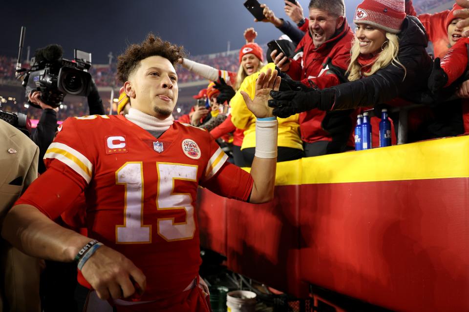 Patrick Mahomes #15 of the Kansas City Chiefs celebrates with fans after defeating the Buffalo Bills in the AFC Divisional Playoff game at Arrowhead Stadium on January 23, 2022 in Kansas City, Missouri. The Kansas City Chiefs defeated the Buffalo Bills with a score of 4 to 36.