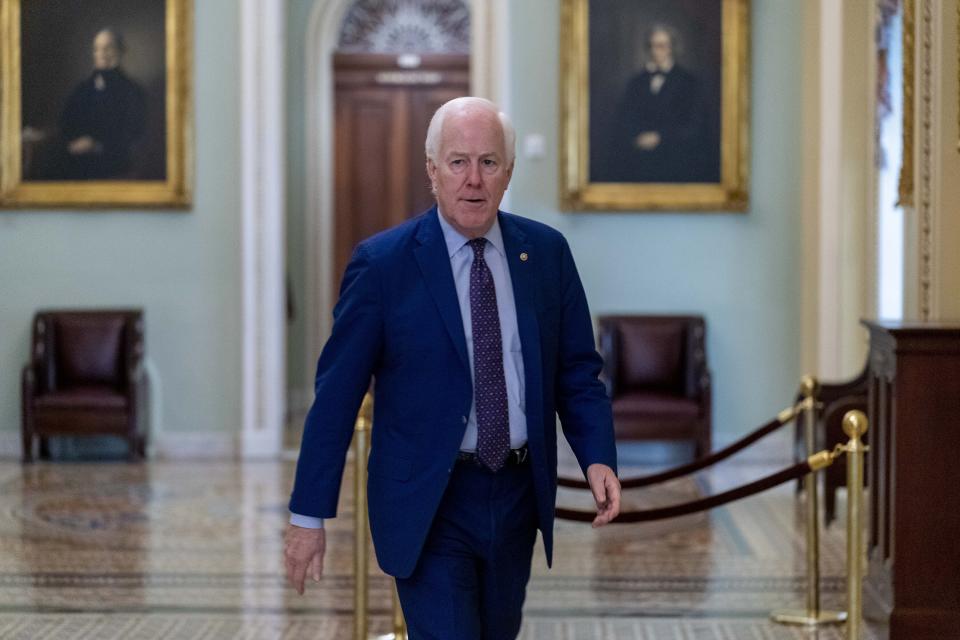 Sen. John Cornyn, R-Texas, walks towards the office of Senate Minority Leader Mitch McConnell of Ky. For a meeting as the $1 trillion bipartisan infrastructure bill gets closer to passage in Washington, Monday, Aug. 9, 2021. (AP Photo/Andrew Harnik)