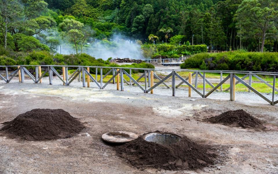 Cooking of Cozido das Furnas meal, Sao Miguel, Azores - DaLiu/iStockphoto