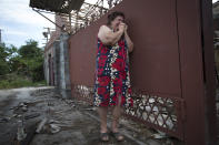 FILE - Yekaterina Len, 61, cries outside her ruined house following a shelling in Slovyansk, eastern Ukraine, Tuesday, May 20, 2014. (AP Photo/Alexander Zemlianichenko, File)