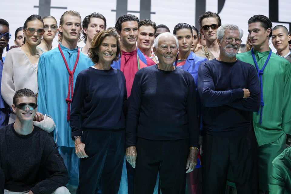 Silvana Armani from centre left, Giorgio Armani and Leo Dell'Orco stand with models after the Emporio Armani Spring Summer 2022 collection during Milan Fashion Week, in Milan, Italy, Thursday, Sept. 23, 2021. (AP Photo/Luca Bruno)