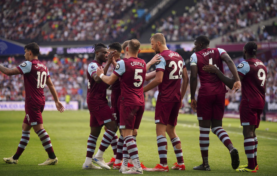 West Ham United's Tomas Soucek, third from right, celebrates scoring their side's second goal of the game with team-mates during the English Premier League soccer between West Ham United and Luton Town match at the London Stadium, London, Saturday May 11, 2024. (Victoria Jones/PA via AP)