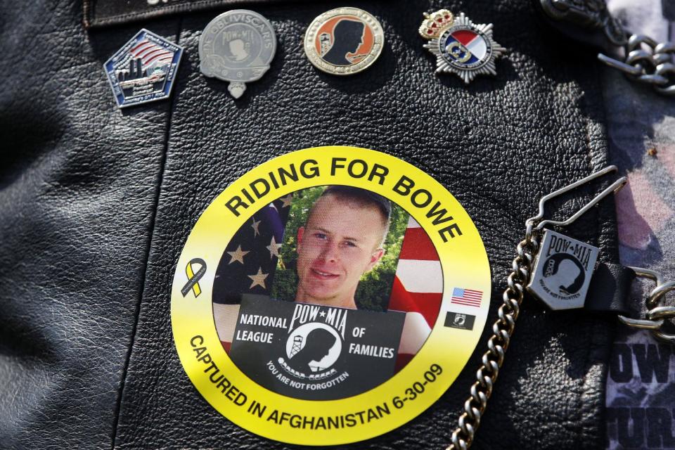 FILE -- The May 27, 2012 file photo shows an image of Army Sgt. Bowe Bergdahl of Hailey, Idaho, who is being held captive in Afghanistan, worn by an audience member as Bergdahl's father Bob spoke at the annual Rolling Thunder rally for POW/MIA awareness, in Washington. The nearly five-year effort to free the only American soldier held captive in Afghanistan is scattered among numerous federal agencies with a loosely organized group of people working on it mostly part time, according to two members of Congress and military officials involved in the effort. An ever-shrinking U.S. military presence in Afghanistan has re-focused attention on efforts to bring home Bergdahl, who has been held by the Taliban since June 30, 2009. (AP Photo/Charles Dharapak, File)