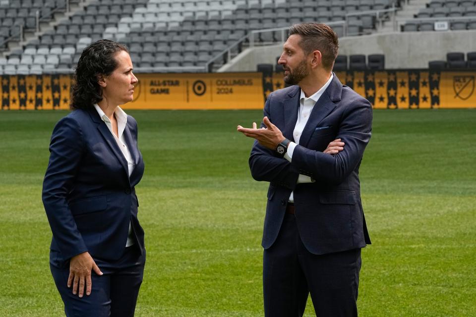 Jun 28, 2023; Columbus, OH, USA;  Columbus Crew president of business operations Kristin Bernert talks to president and general manager Tim Bezbatchenko prior to an announcement at Lower.com Field that the 2024 MLS All Star Game will be in Columbus.