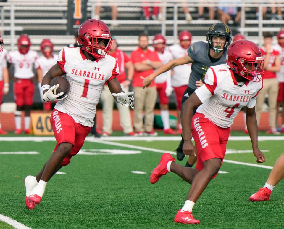 Seabreeze's Denali Campbell (1) runs the opening play back for TD during Kickoff Classic game with Viera at New Smyrna Beach Sports Complex, Friday, Aug.18, 2023. 