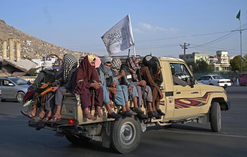 <div class="inline-image__caption"><p>Taliban fighters in a vehicle patrol the streets of Kabul on Aug. 23, 2021.</p></div> <div class="inline-image__credit">Wakil Koshar/AFP via Getty</div>