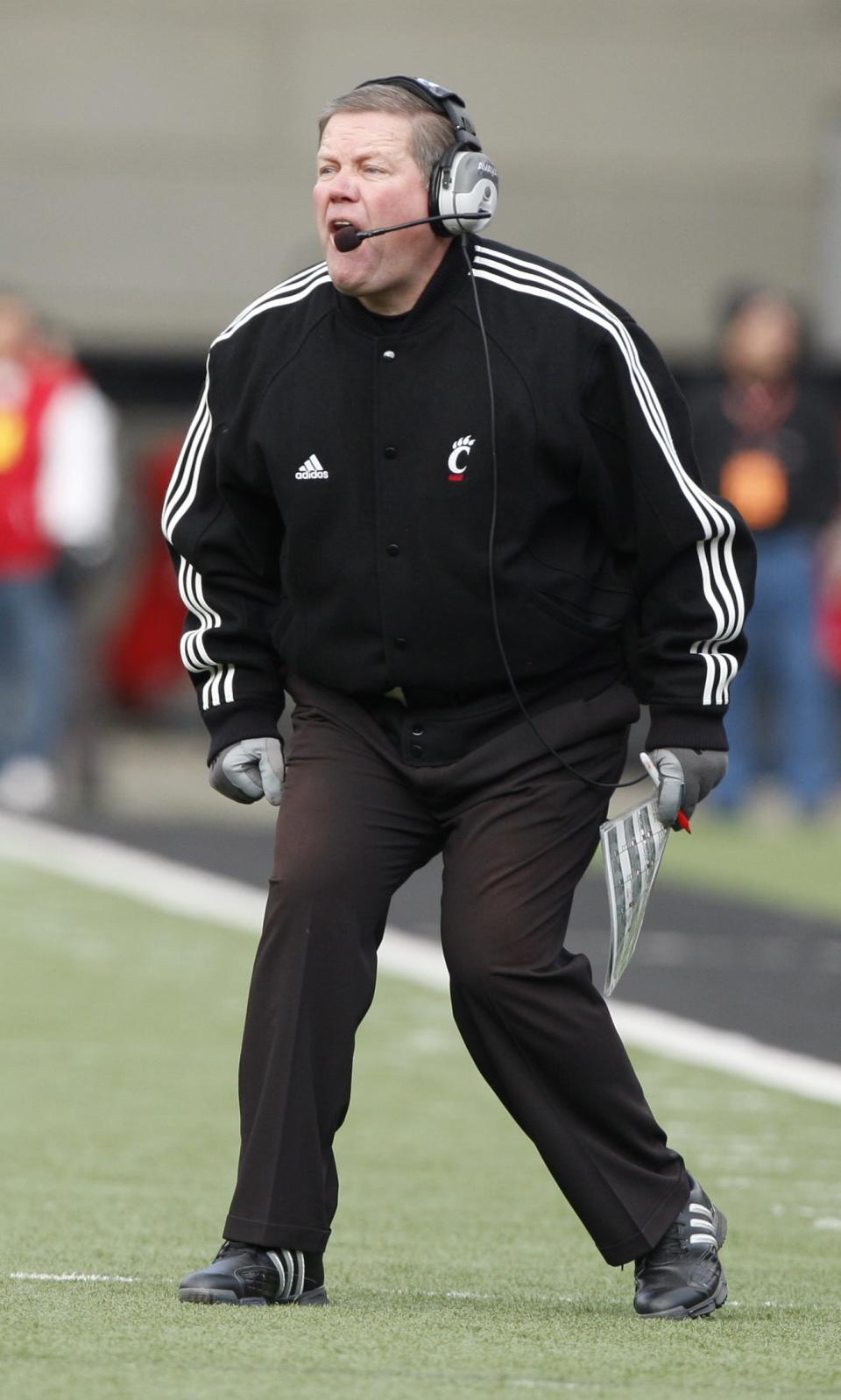 Then-University of Cincinnati head coach Brian Kelly yells instructions during the fourth quarter against Illinois at Nippert Stadium, Nov. 27, 2009. Kelly coached both Jason and Travis Kelce who will play against each other in Super Bowl 57.