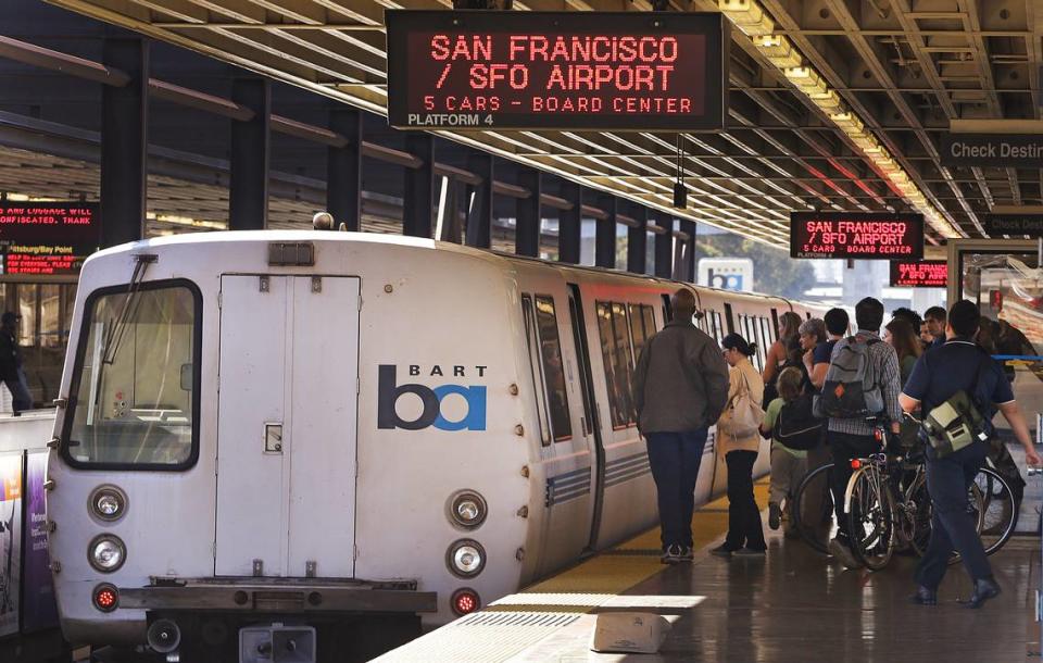 In this Oct. 15, 2013, file photo, passengers board a Bay Area Rapid Transit train in Oakland. BART is one of several public transit agencies that claims it’s in need of more state money to stay afloat.