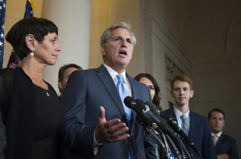 House Majority Leader Kevin McCarthy (C) speaks to the press after dropping out of the race to become Speaker of the House on Capitol Hill in Washington, DC, October 8, 2015