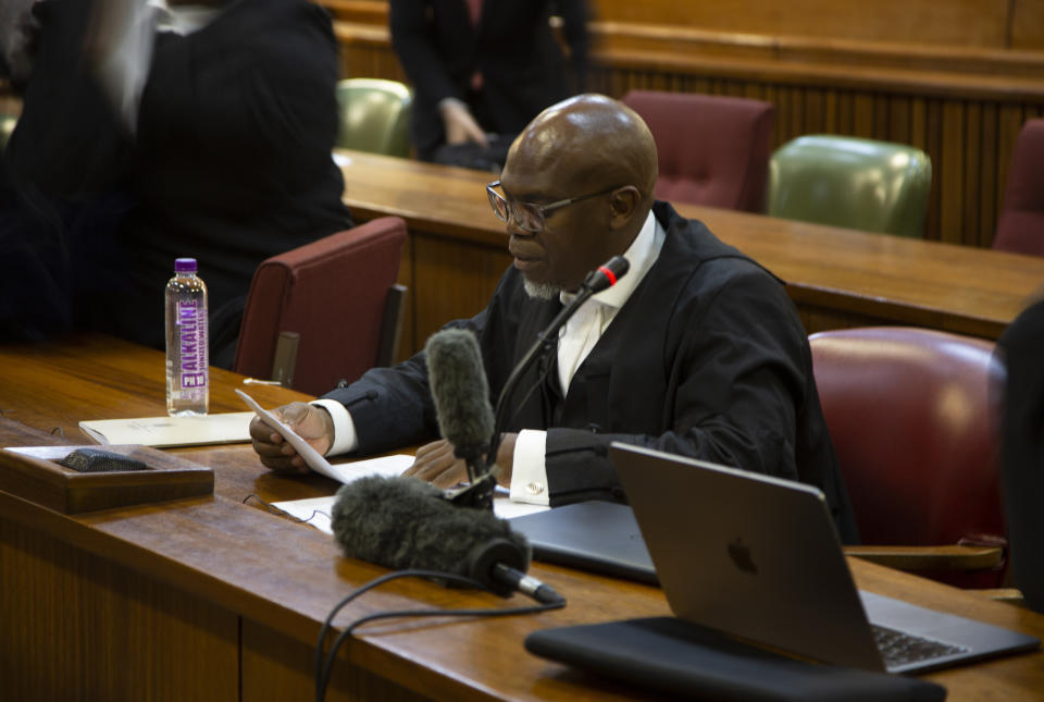 National Prosecuting Authoritie's Adv. Machos Gwala in the High Court in Pretoria, South Africa, Monday March 25, 2024. South African prosecutors say they intend to charge the Parliament speaker with corruption. They allege she took $135,000 and a wig in bribes from an unnamed person over a three-year period while she was defense minister. (AP Photo/Denis Farrell)