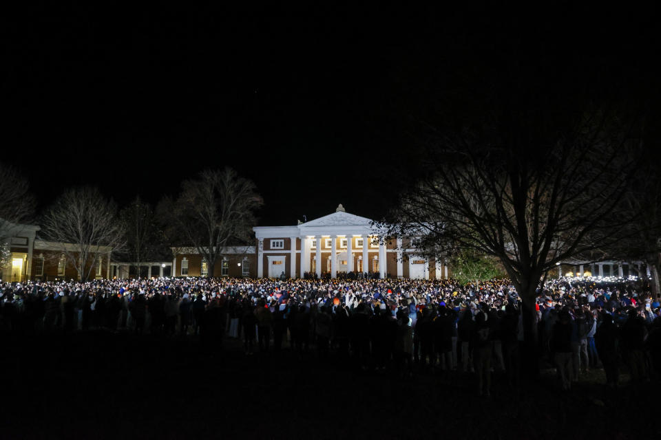 Students and community members gather for a candlelight vigil after a shooting that left three students dead the night before at the University of Virginia, Monday, Nov. 14, 2022, in Charlottesville, Va. (Shaban Athuman/Richmond Times-Dispatch via AP)